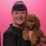 Our groomer Melisa with a brown dog