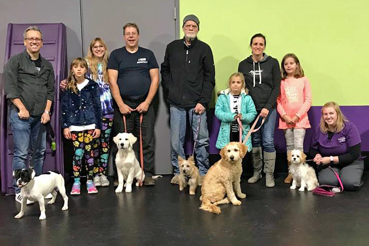 Owners and their dogs after training class